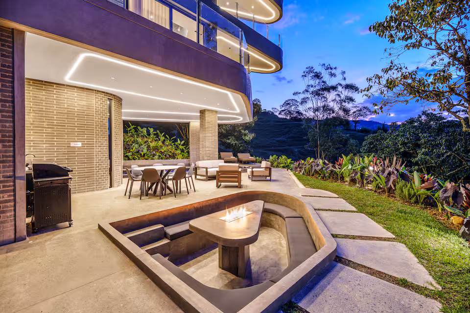 Outdoor villa terrace with fire feature and evening seating